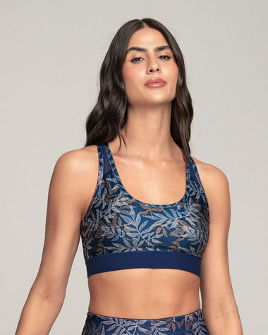 Top deportivo con espalda atlética en material de secado rápido#color_a04-estampado-hojas-azules