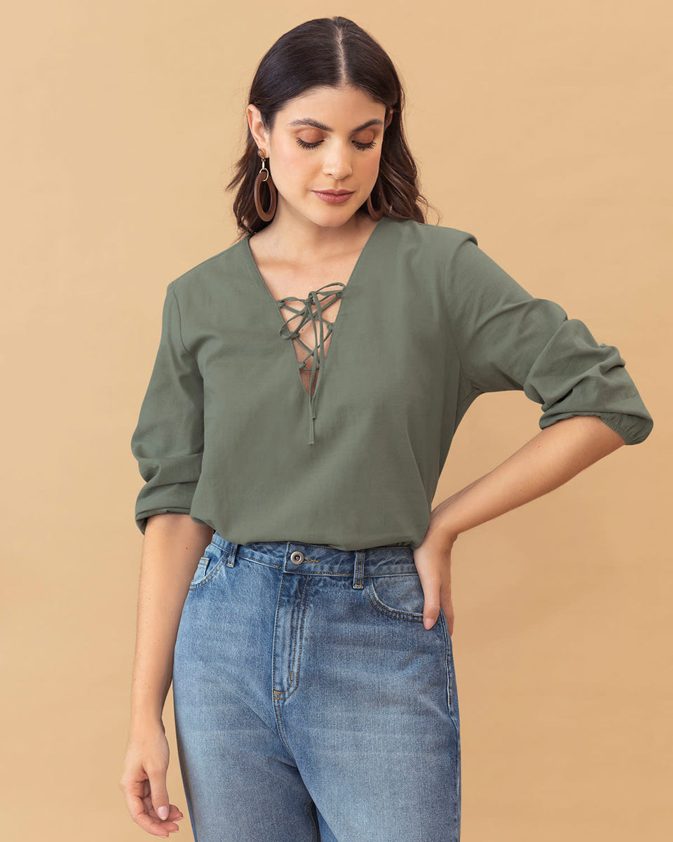 Blusa manga 3/4 con tiras decorativas en escote