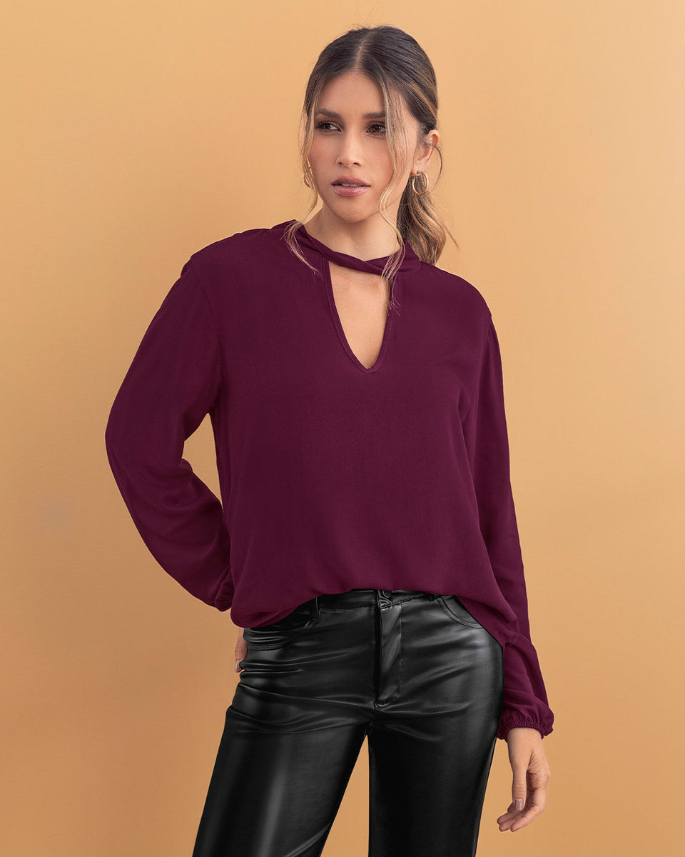 Blusa manga larga con abertura en escote