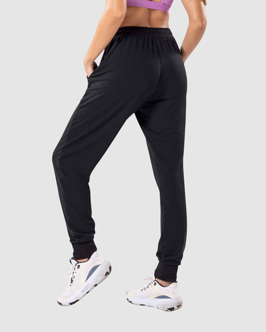 Jogger deportivo de silueta amplia con bolsillos#color_700-negro