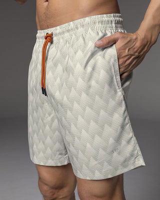 Pantaloneta deportiva con bolsillos funcionales#color_a92-estampado-triangulo