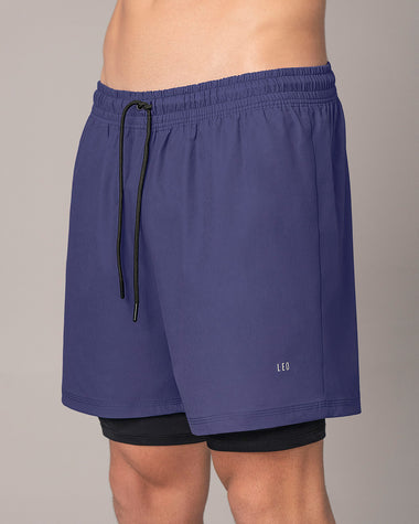 Pantaloneta deportiva con bolsillo lateral con bóxer interno#color_522-estampado-camuflado-azul