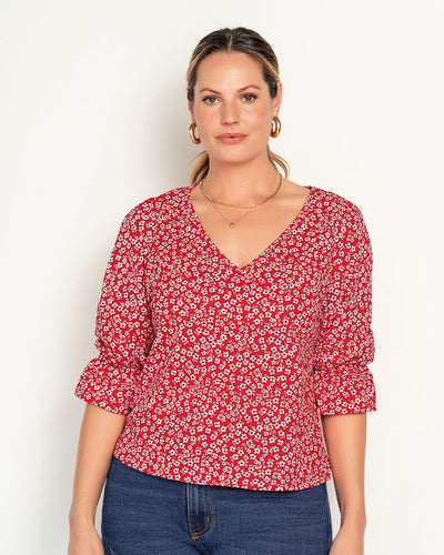 Blusa estampada con elástico recogido para mangas tipo globo#color_145-estampado-rojo-margaritas