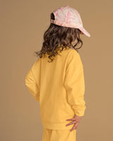 Buzo manga larga con cuello redondo y hombro caído#color_107-amarillo