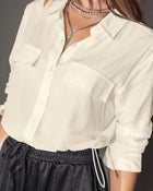 Blusa manga larga con botones funcionales y elástico en borde