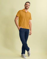 Camiseta tipo polo con botones funcionales con puños y cuello tejido#color_113-mostaza