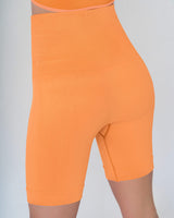 Short ciclista sin costuras control fuerte en abdomen medio y moderado en muslos#color_203-naranja-medio