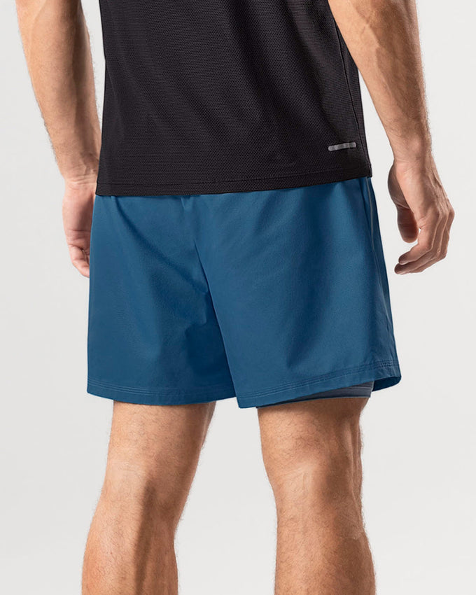 Pantaloneta deportiva con bolsillo lateral con bóxer interno#color_512-azul
